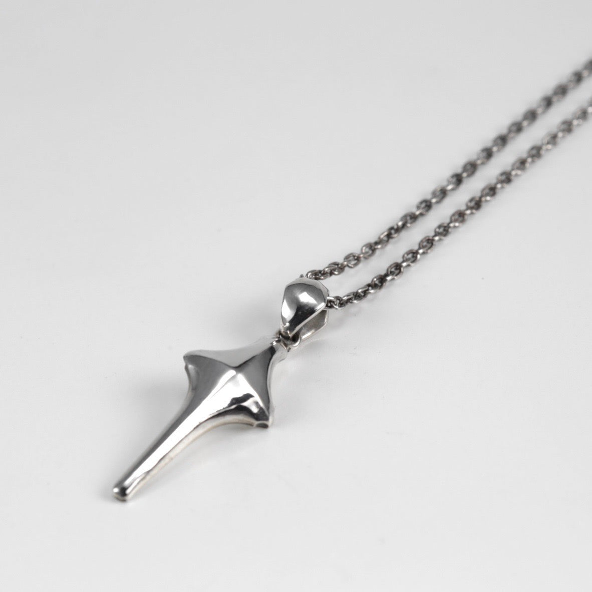 Crossed edge Pendant